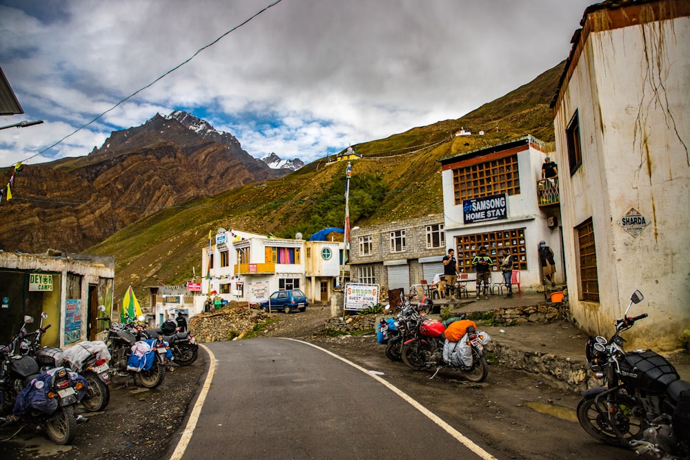 a group of motorcycles parked on the side of a road