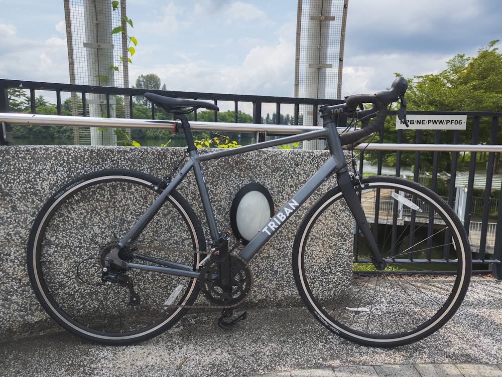 a bicycle parked on a sidewalk