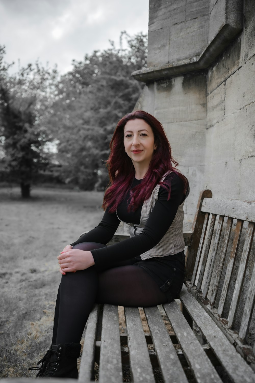 a woman sitting on a bench