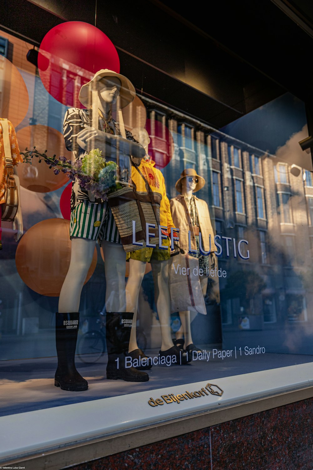 a window display of mannequins in a store