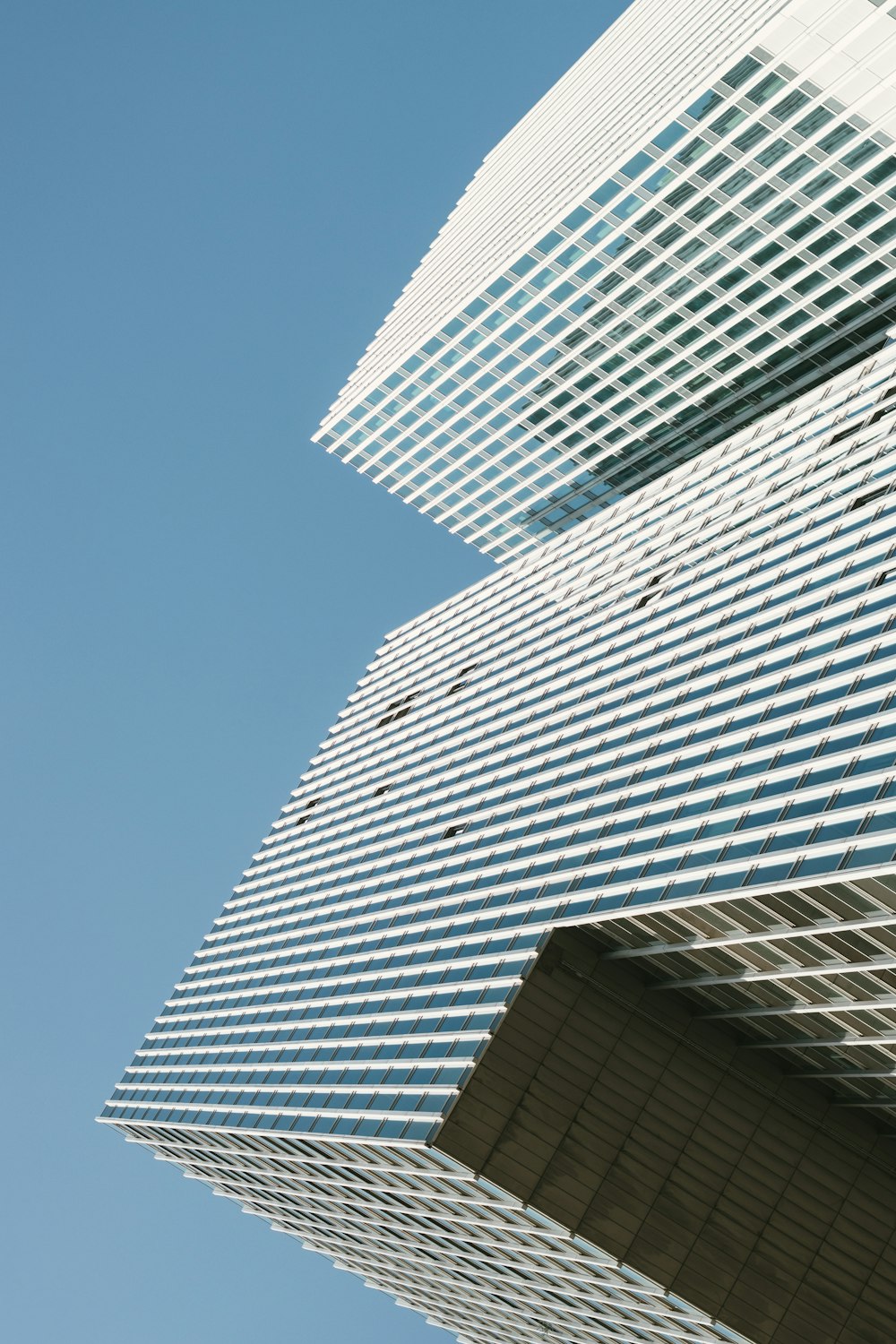 a tall building with a blue sky