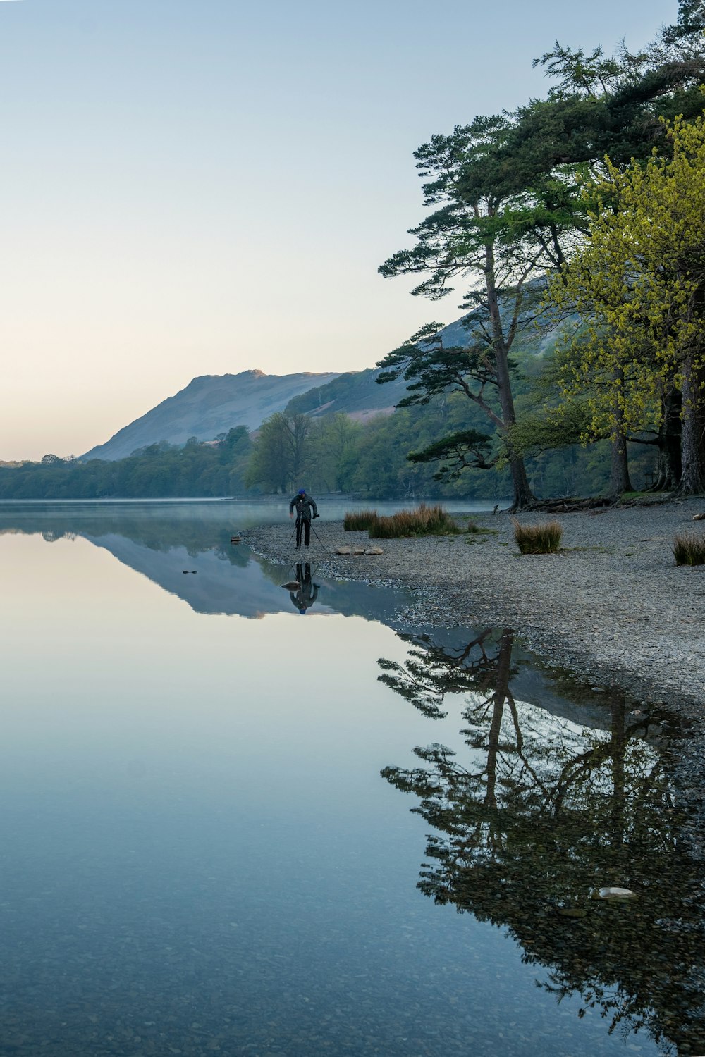 a person riding a bicycle on a lake