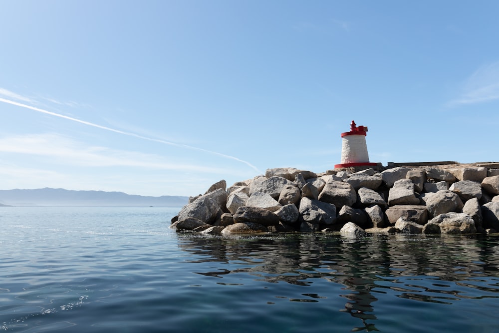 a lighthouse on a rocky island