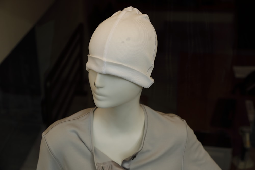 a mannequin wearing a white mask