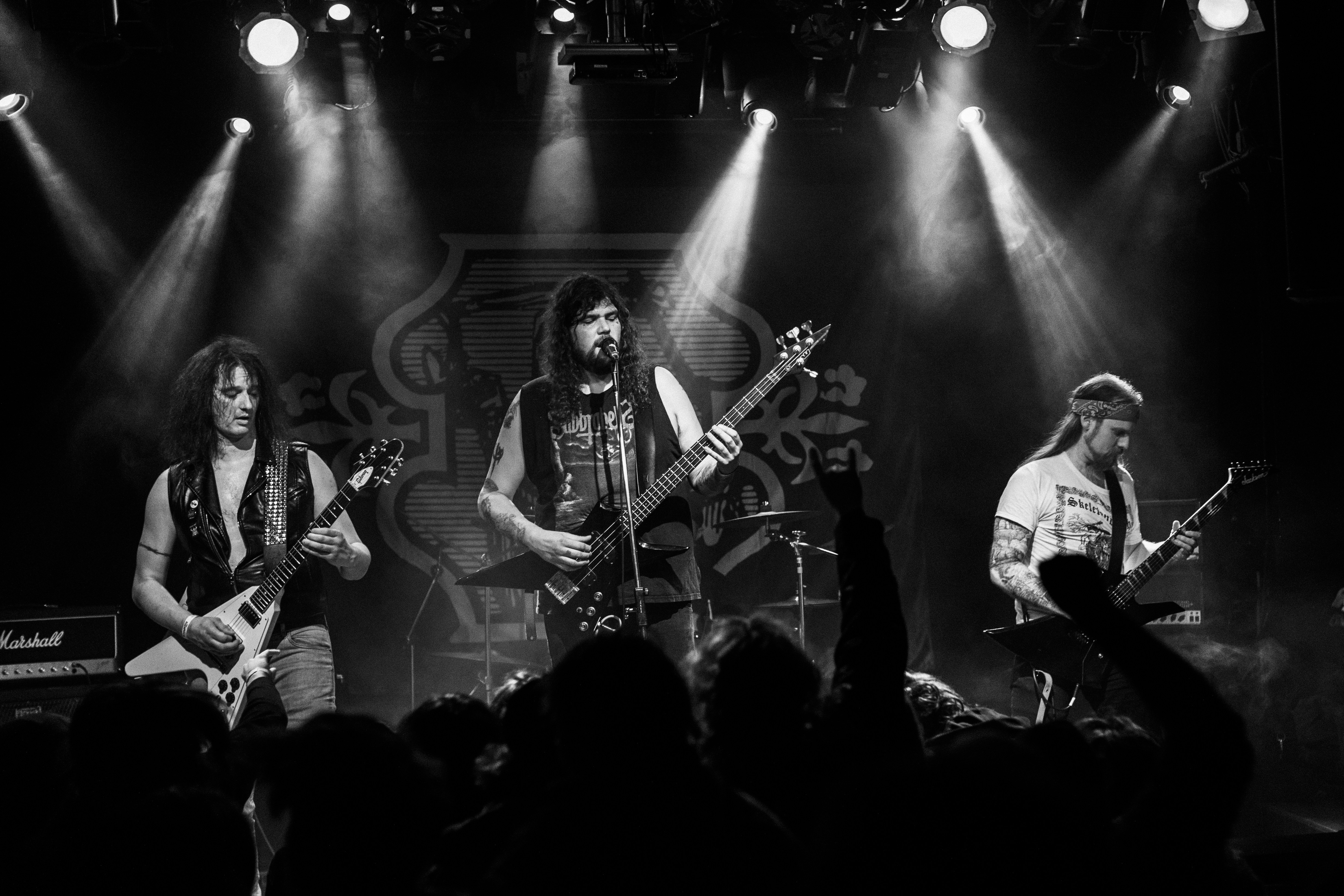 a group of people playing instruments on a stage