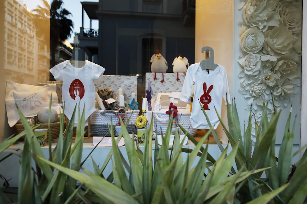 a table with white flowers and a white tablecloth with a white tablecloth and a white table