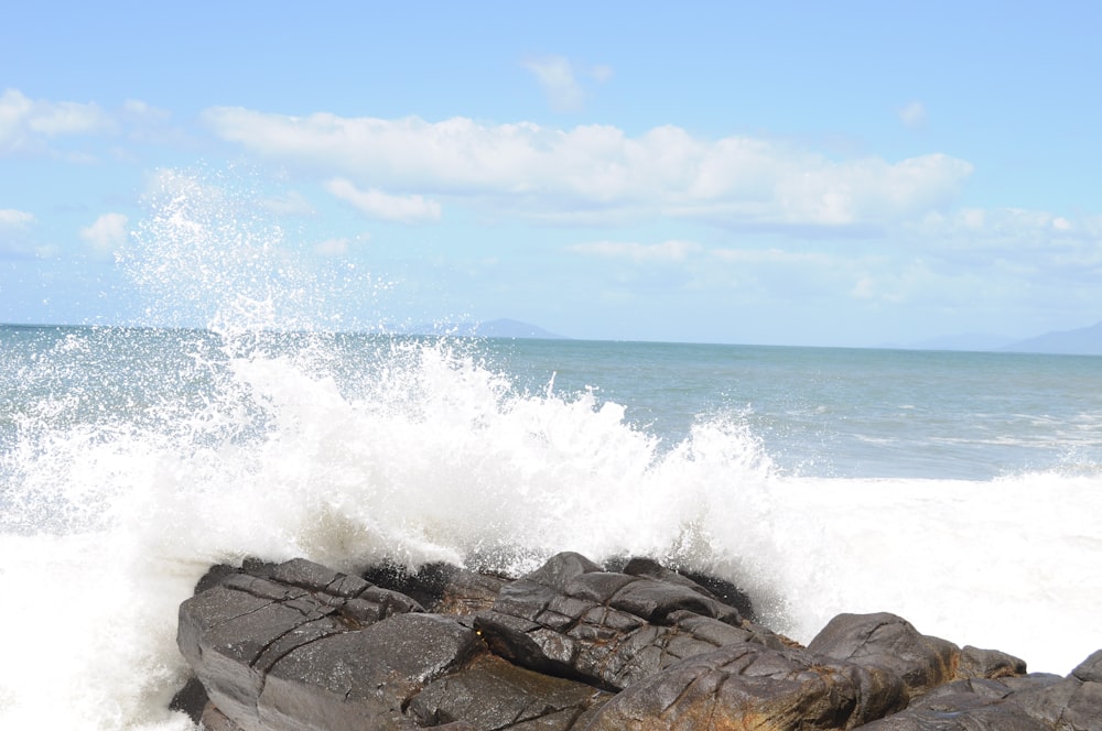 waves crashing on rocks