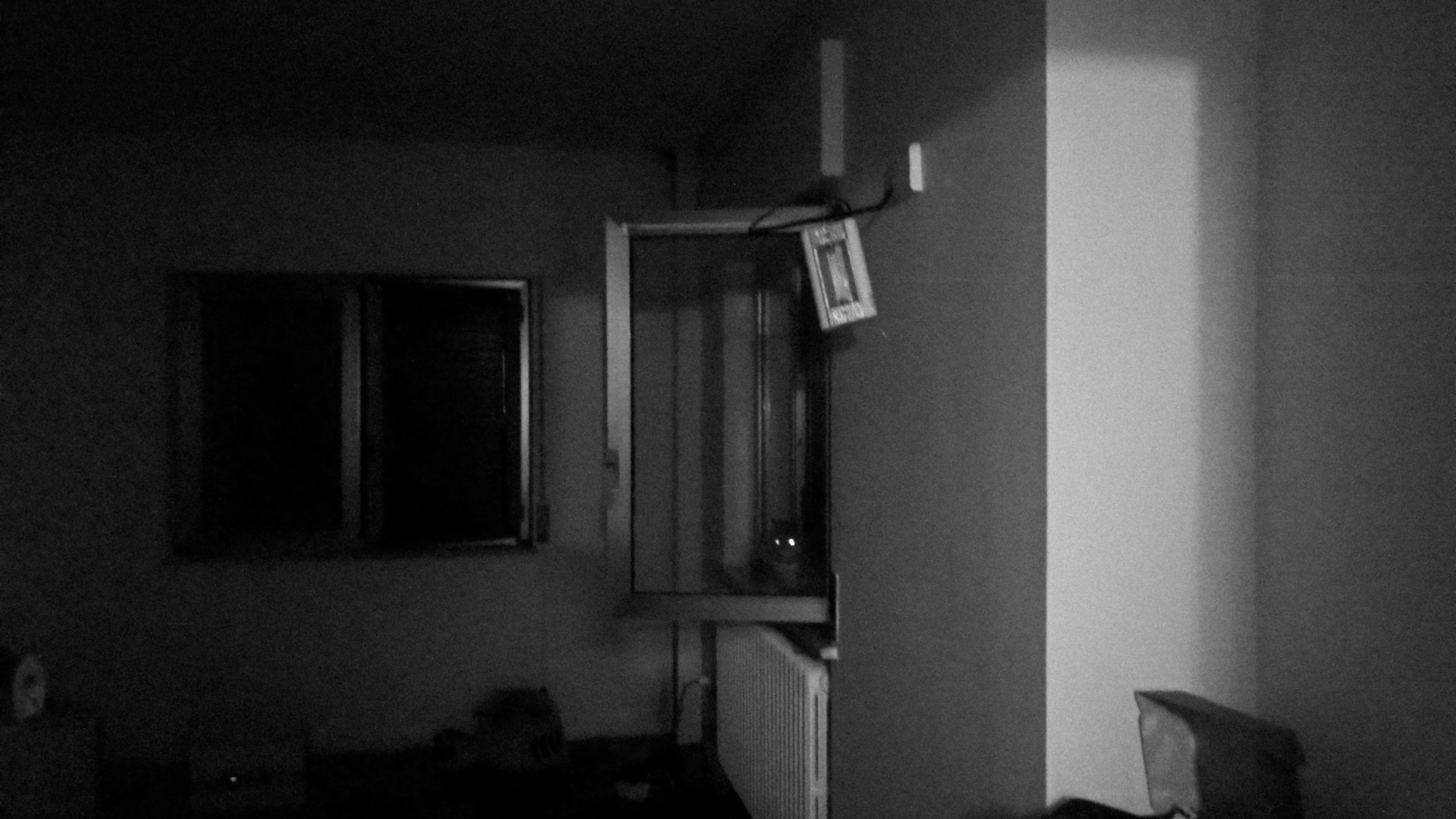 a room with a mirror and a fireplace