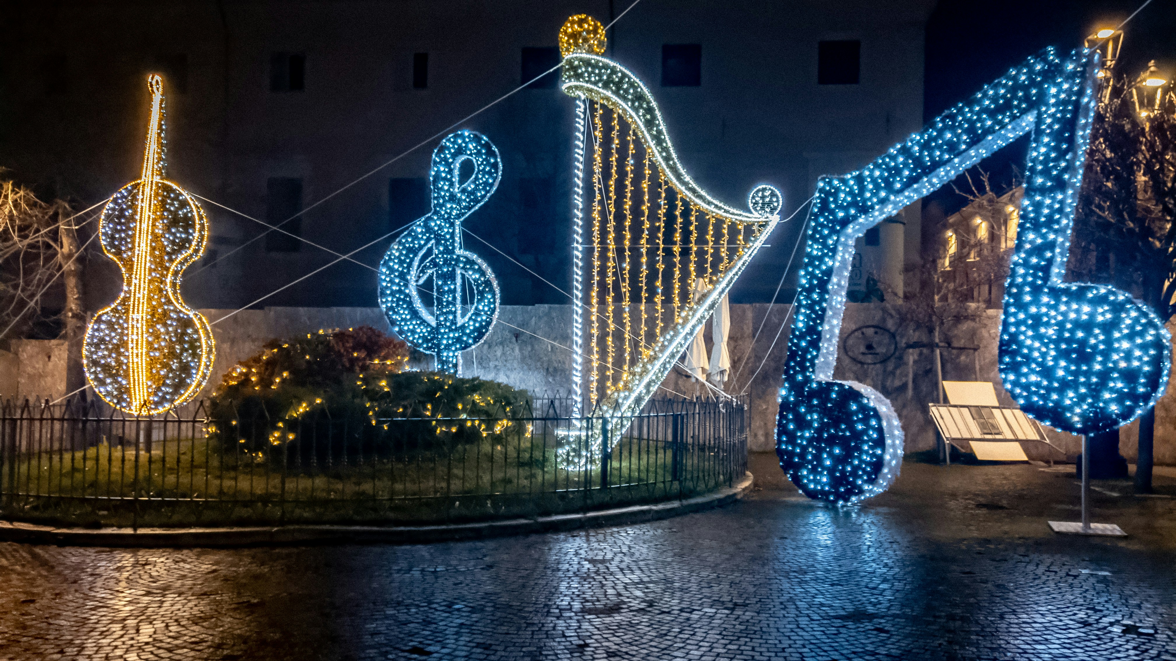 a bridge with lights and trees