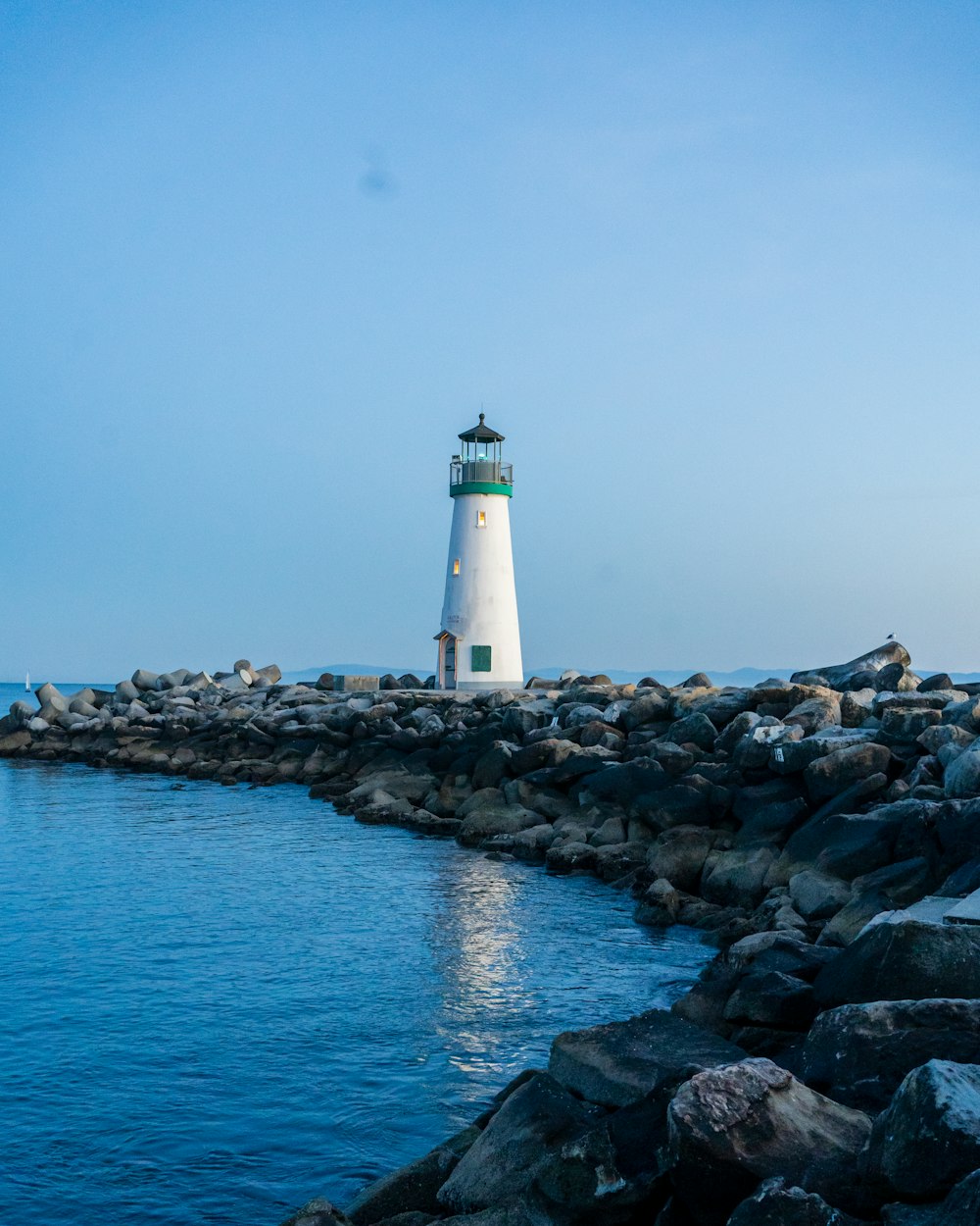 a lighthouse on a rocky shore