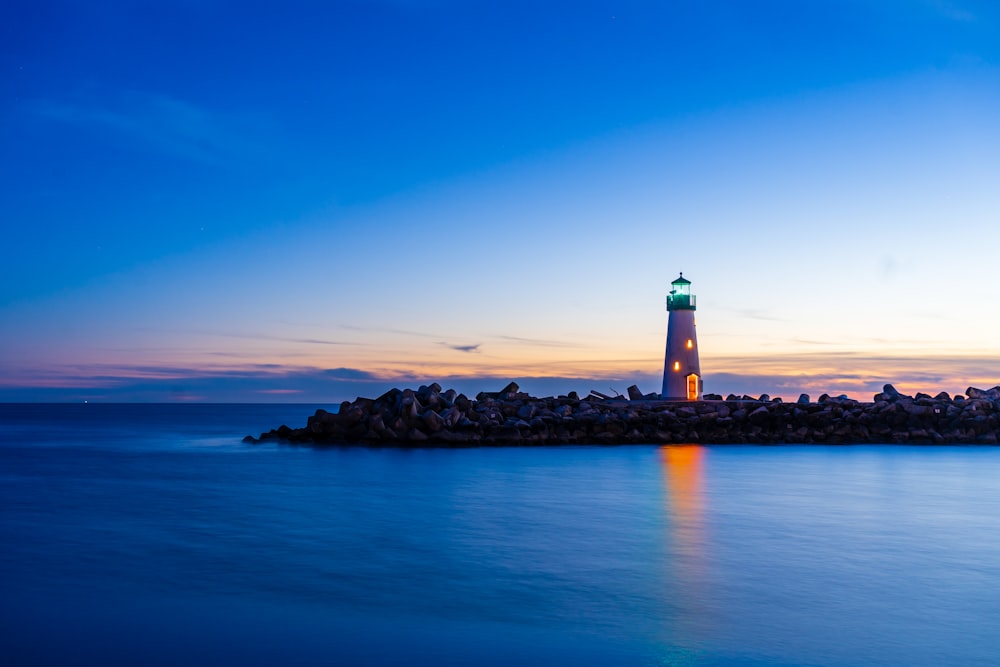 a lighthouse on a rocky island