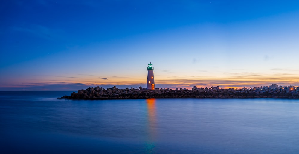 a lighthouse on a rocky island