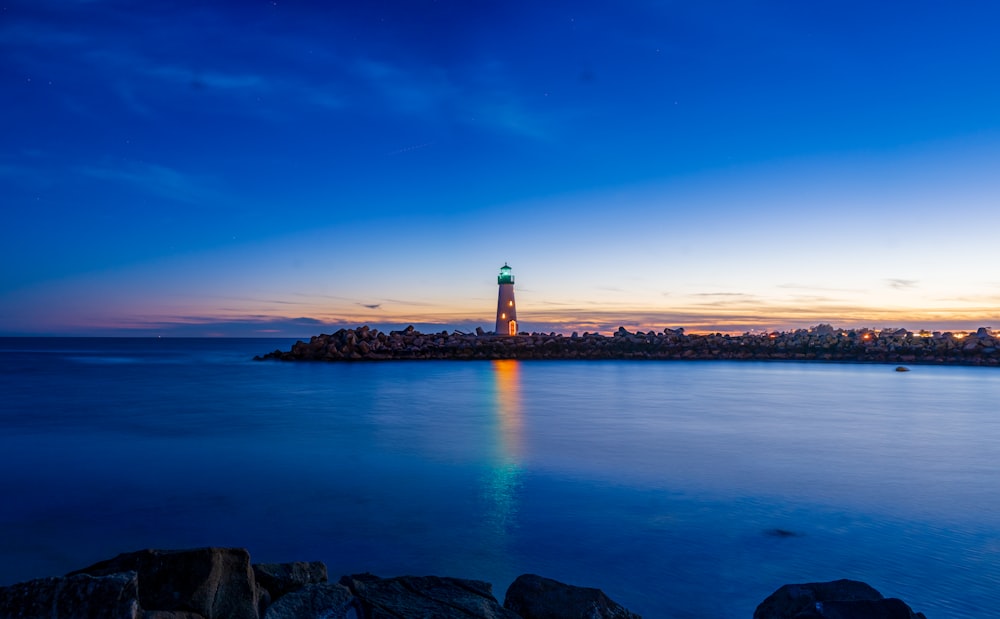 a lighthouse on a rocky island