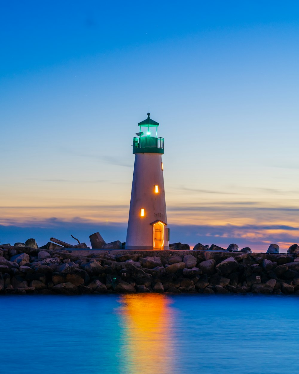 a lighthouse on a rocky shore