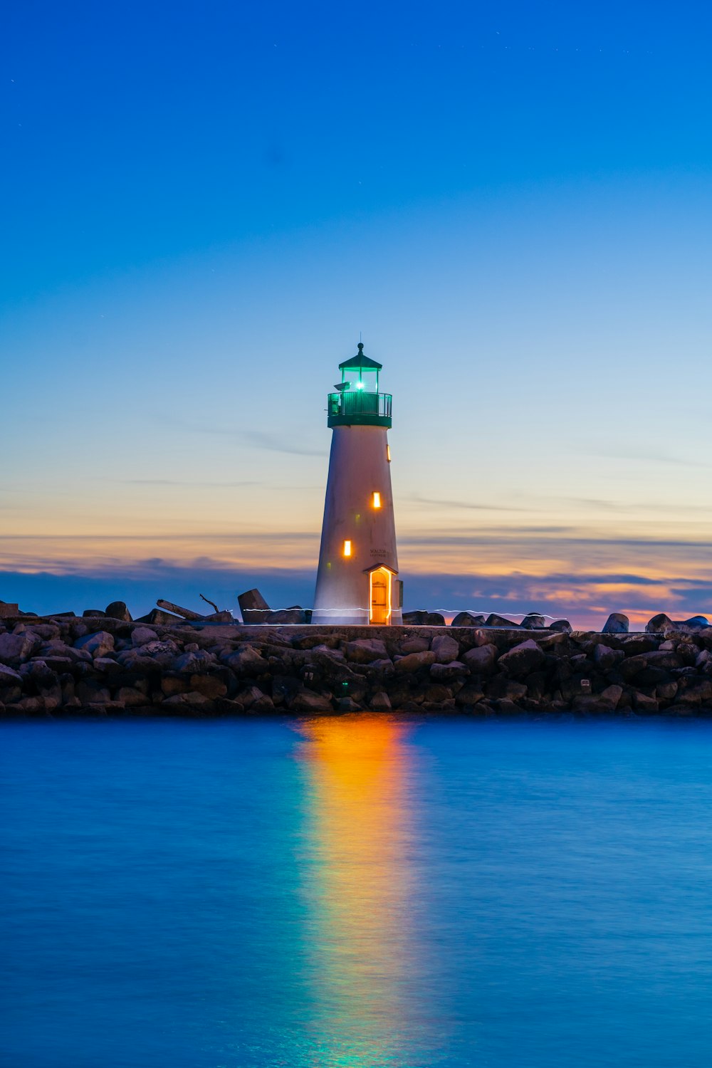 a lighthouse on a rocky shore