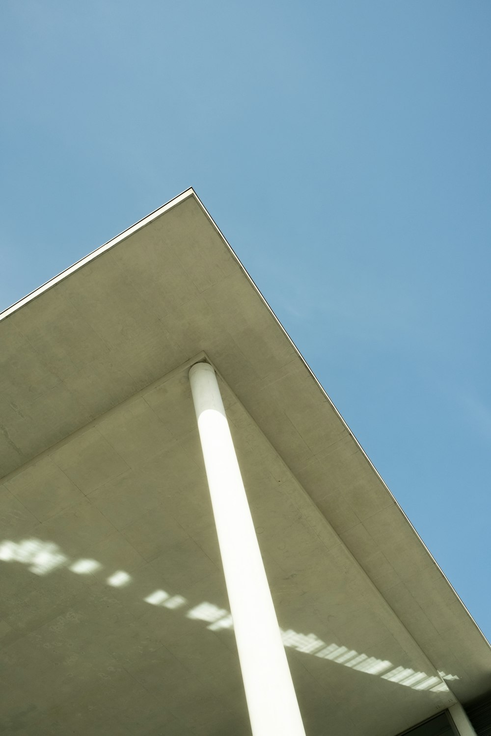 a large building with a blue sky