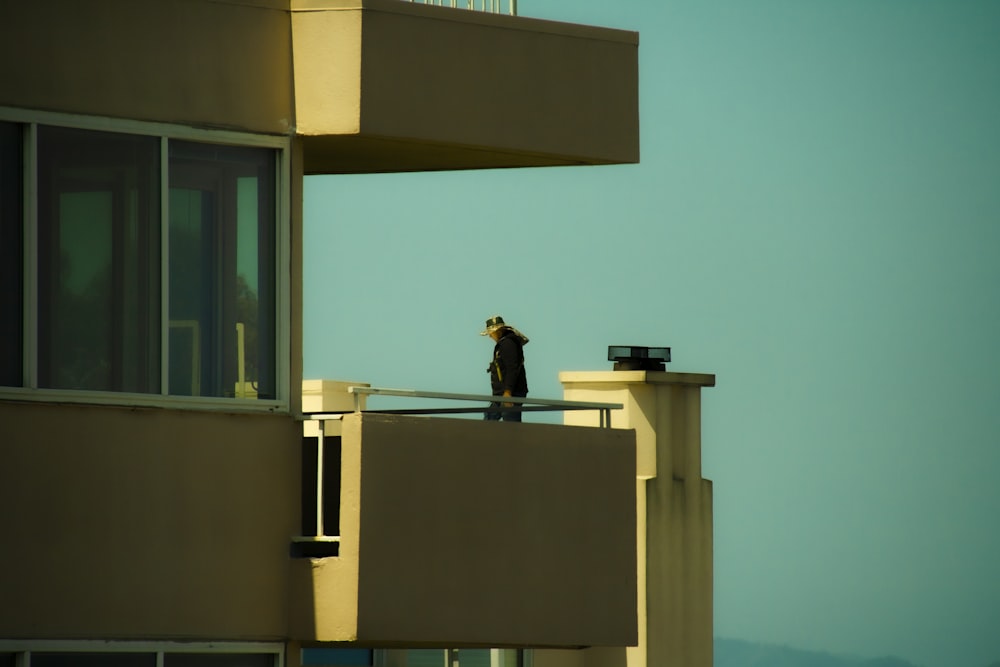 a person standing on a balcony