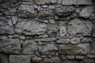 A detailed view of a stone wall construction.