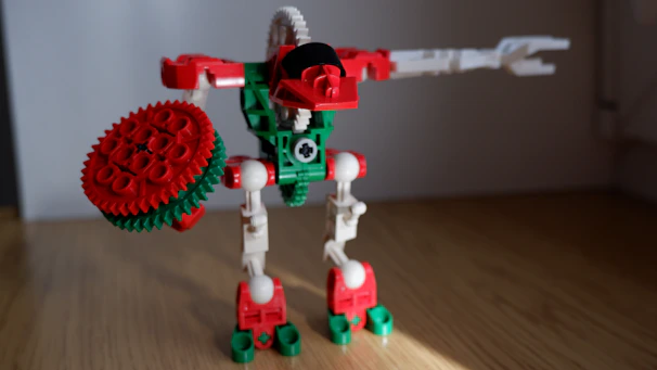 Brickman character demonstrating a robot in action to an engaged group of kids.