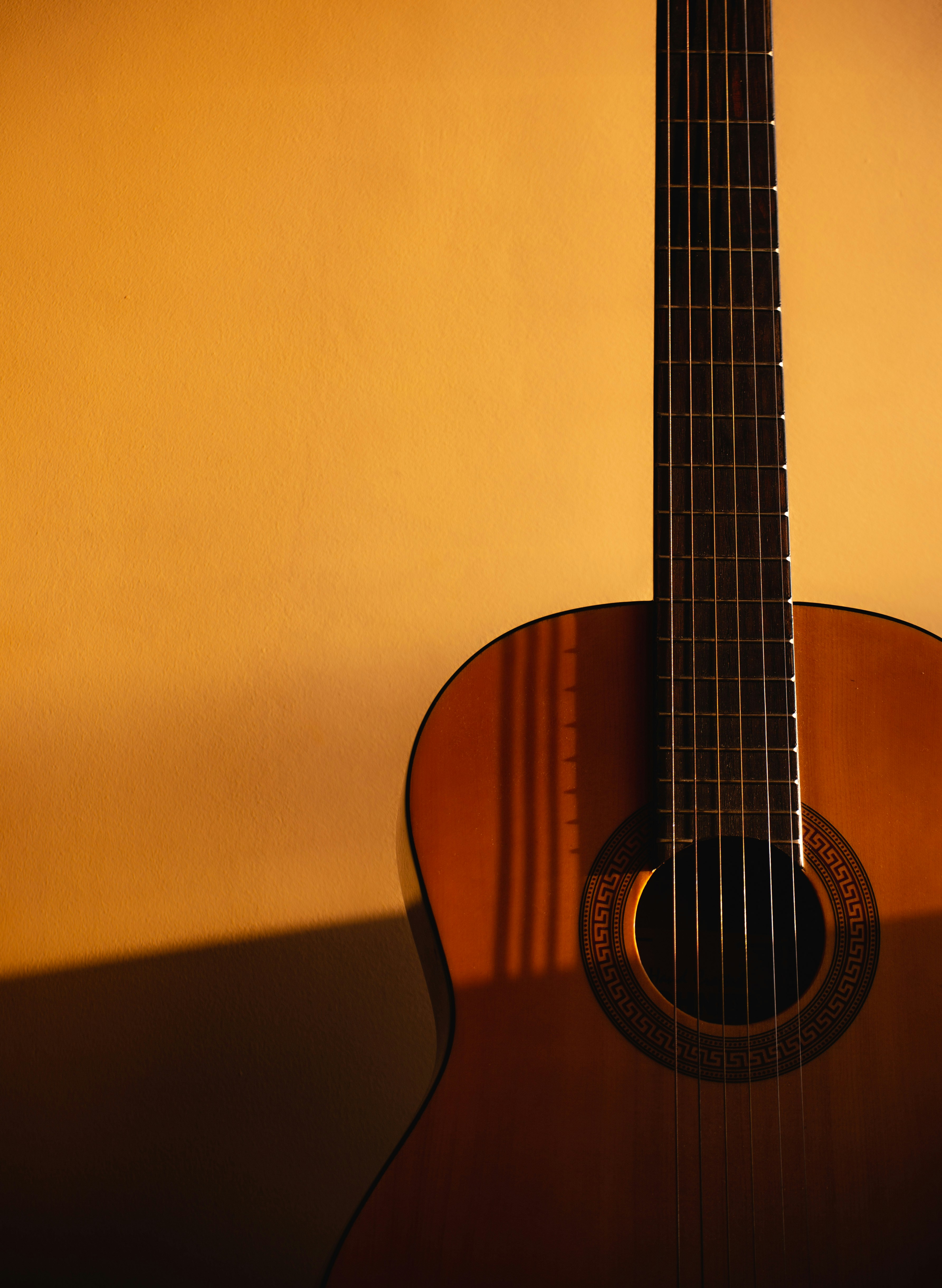 a guitar leaning against a wall