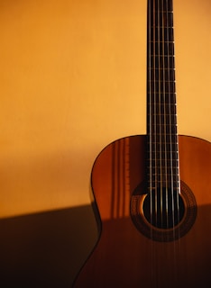 a guitar leaning against a wall