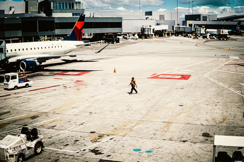 a person walking next to an airplane