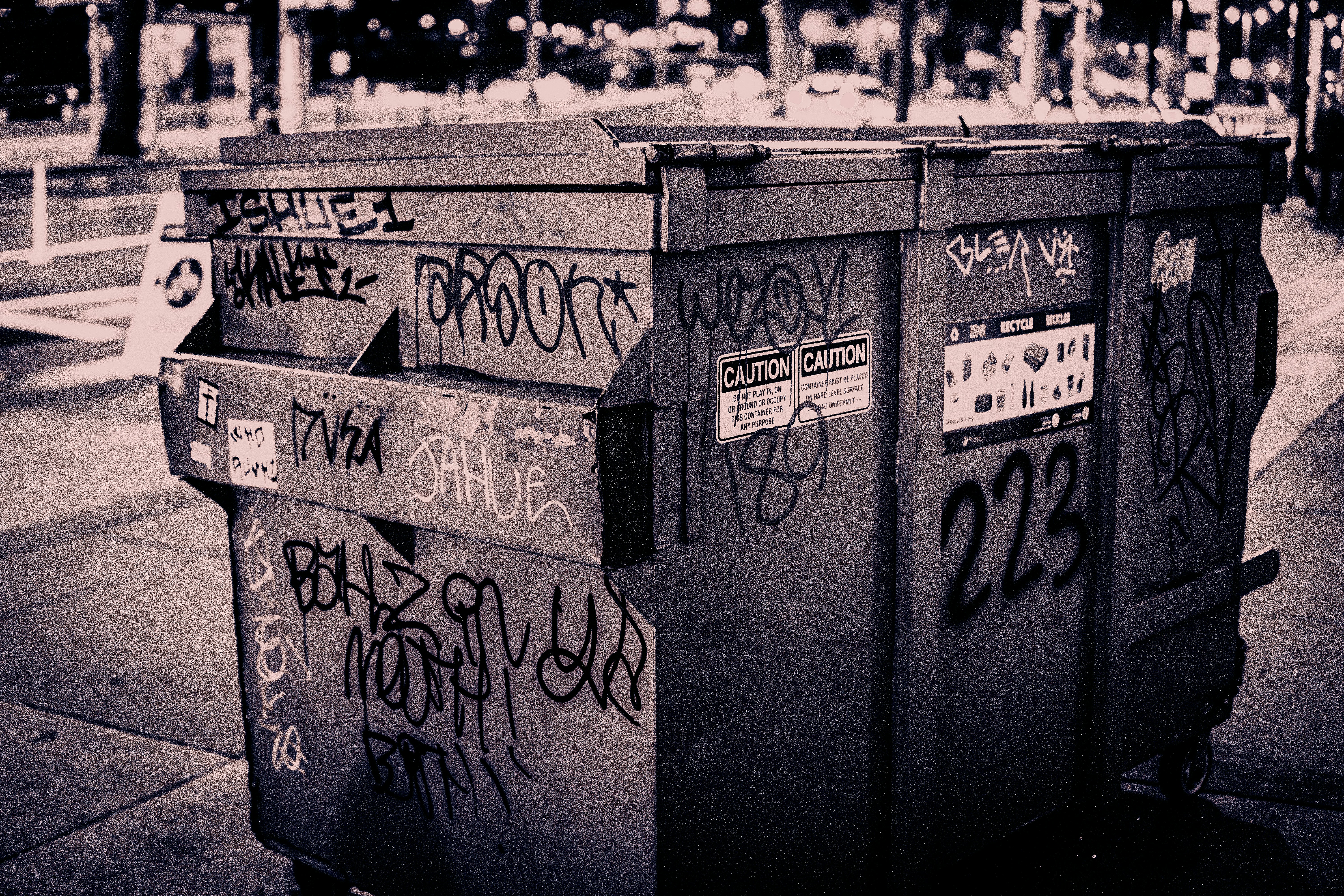 a row of mailboxes with graffiti on them