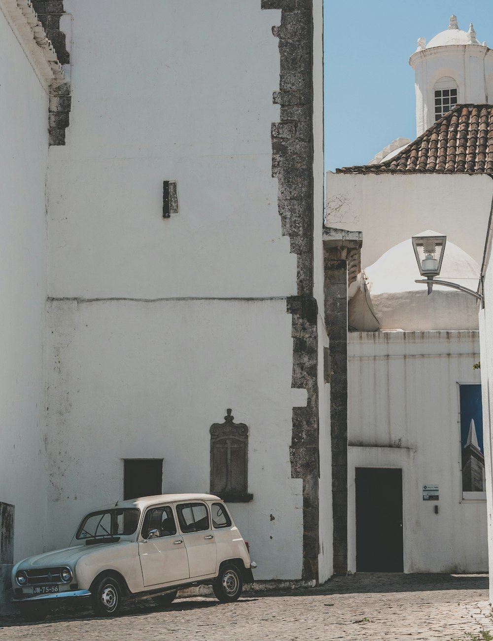 a car parked next to a building