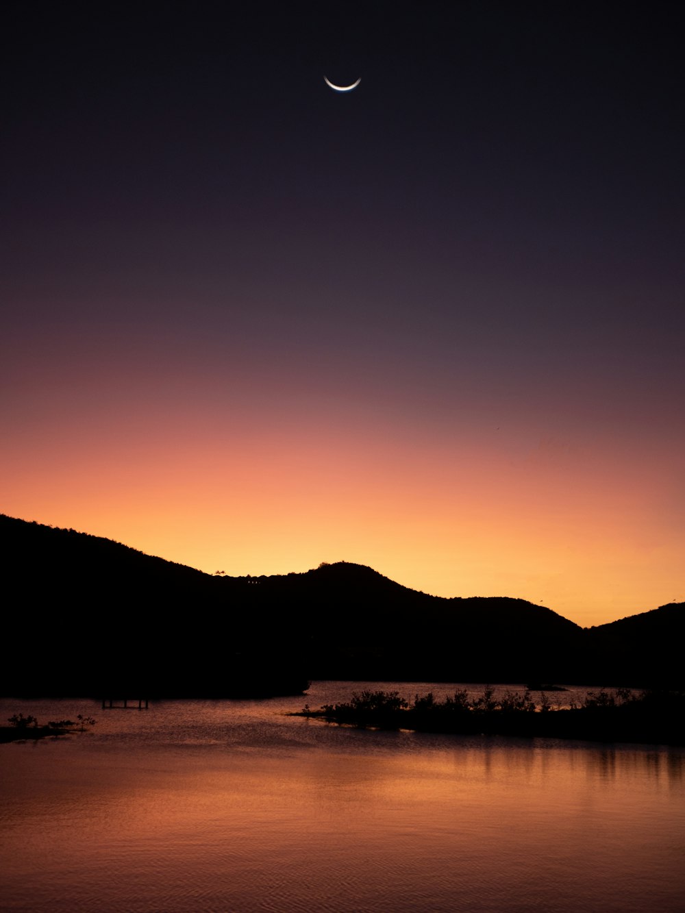 a sunset over a lake