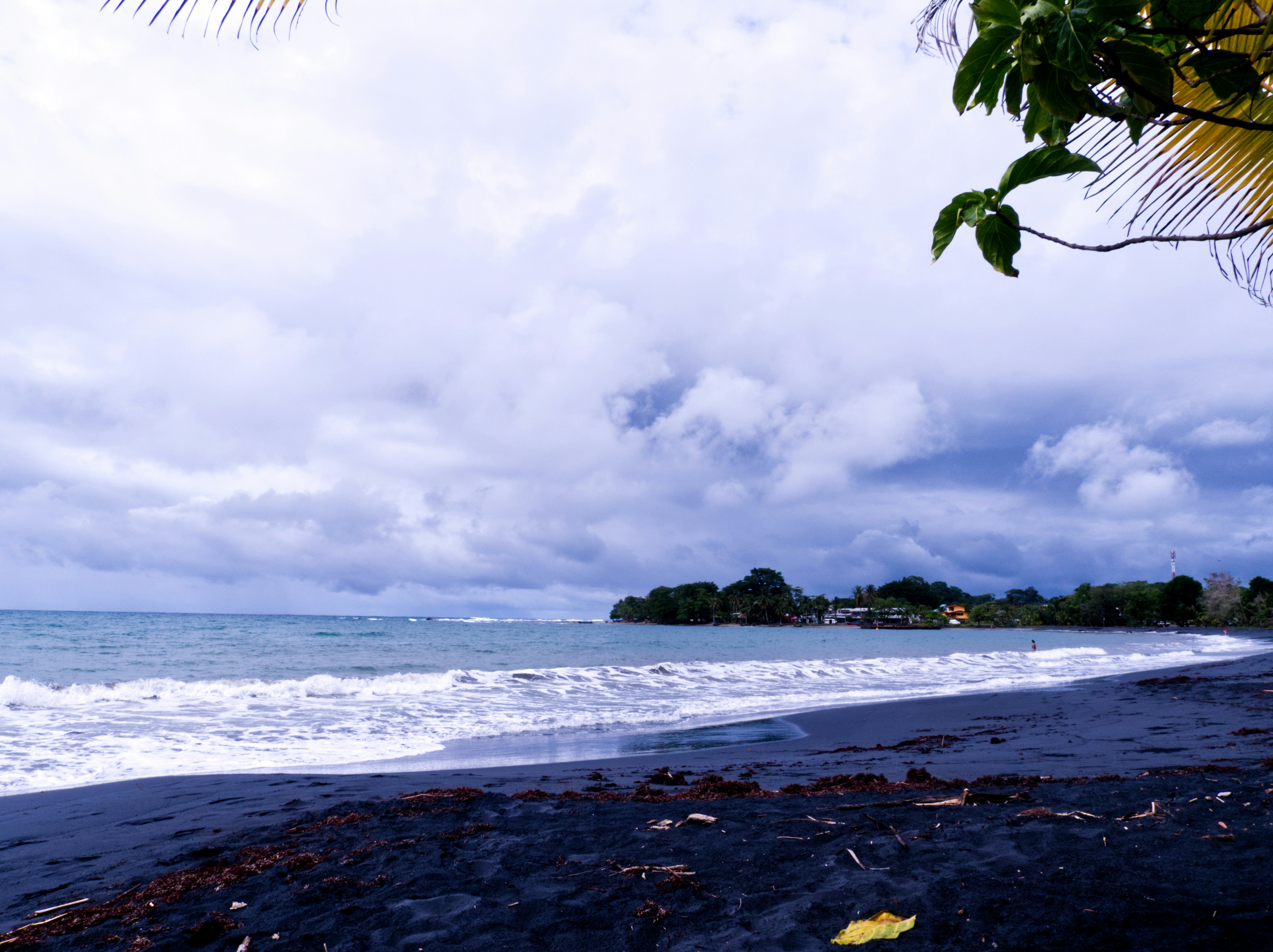 a beach with waves crashing on it