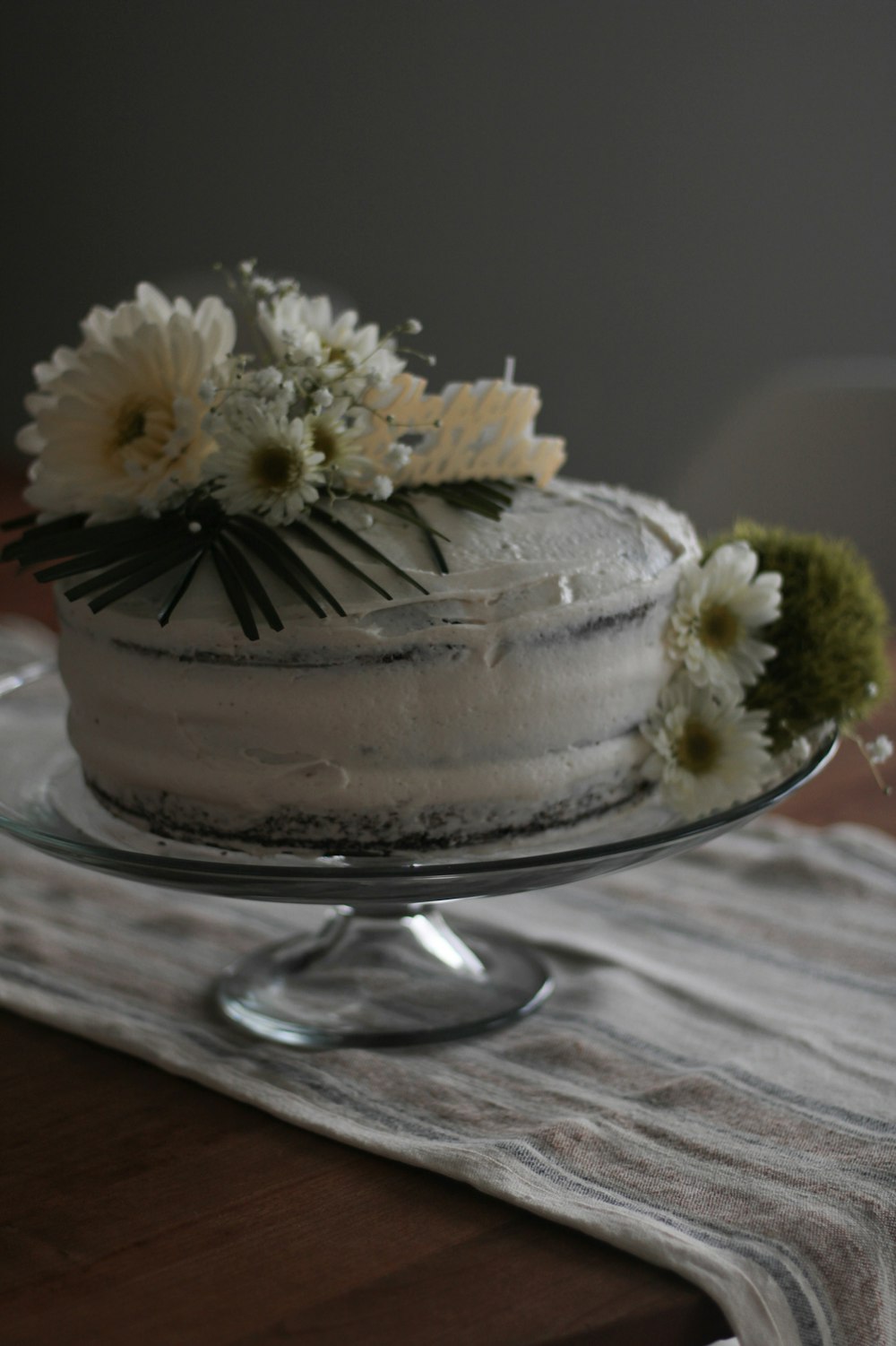 a cake with white flowers on top