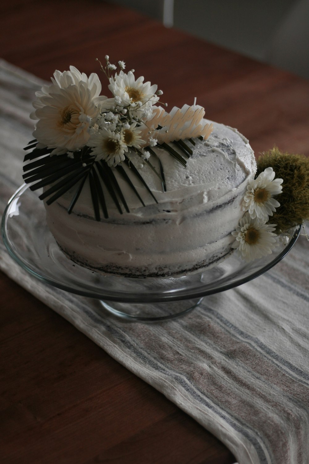 a cake with white frosting