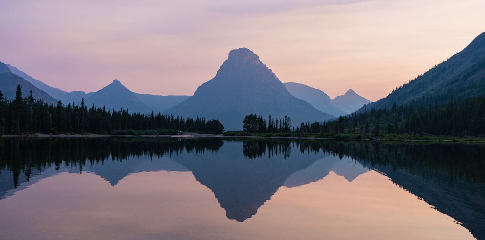 a lake with mountains in the background