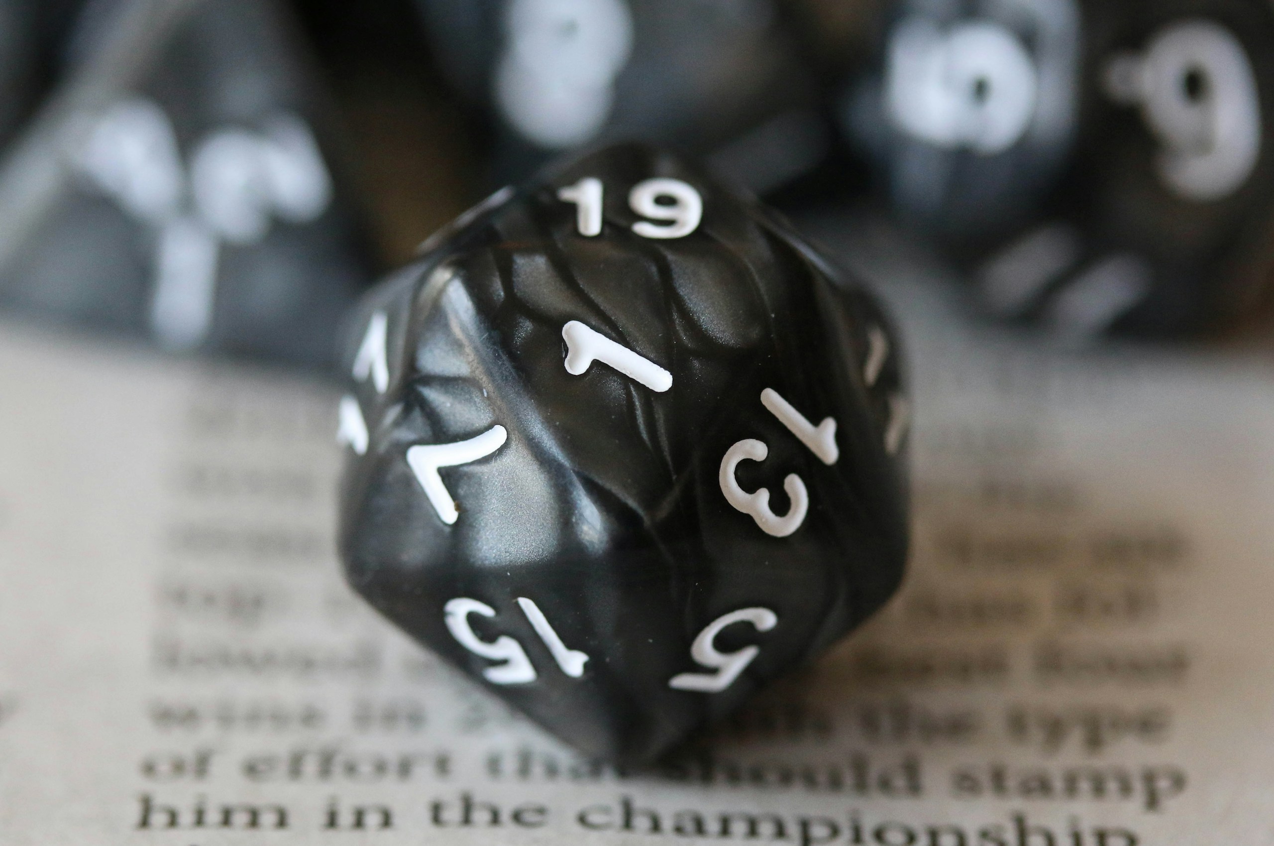 Dungeons and Dragons dice showing a nat 1 rolled on a d20.