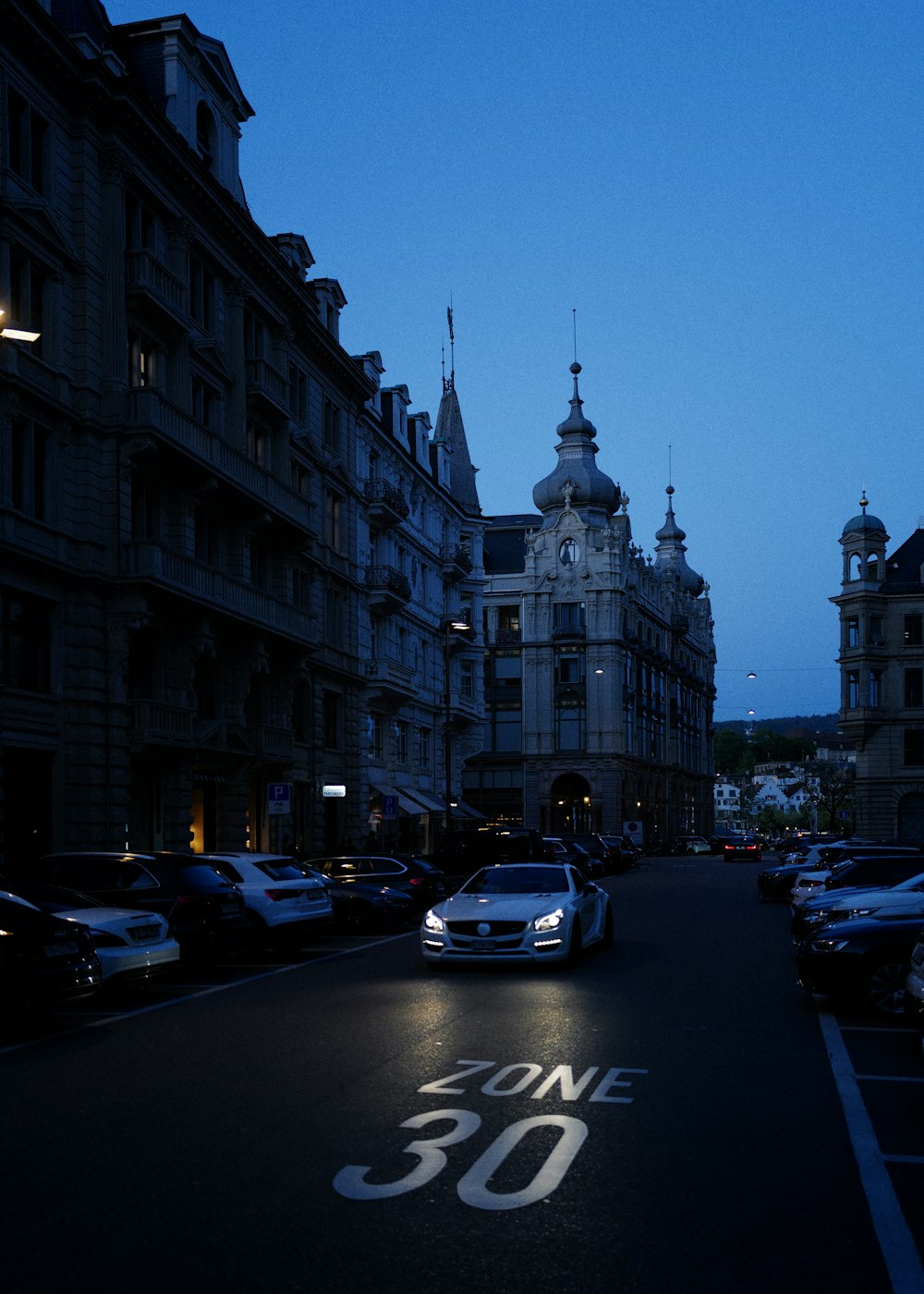 a street with cars and buildings on either side of it