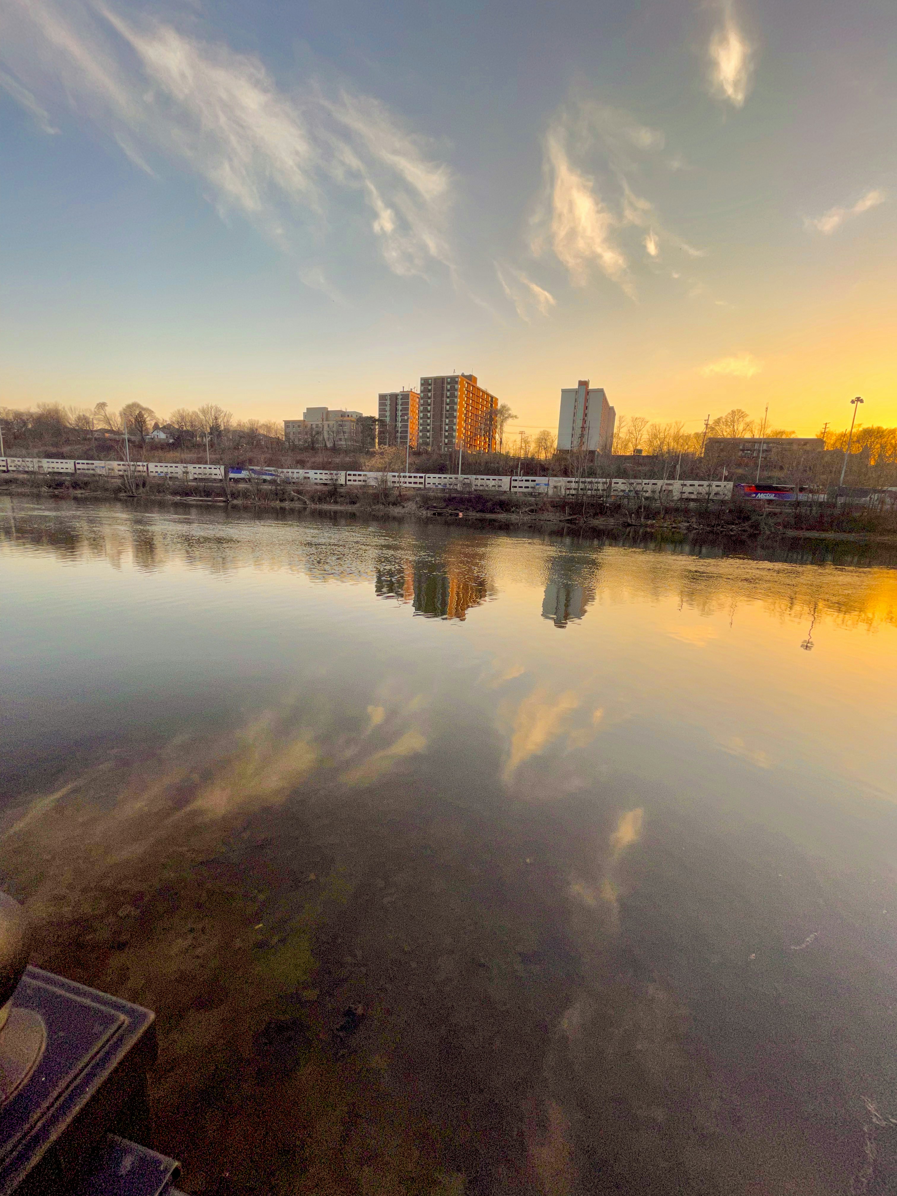 a body of water with buildings in the background