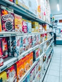 Bulk boxes of breakfast cereals stacked in a clean storage area.