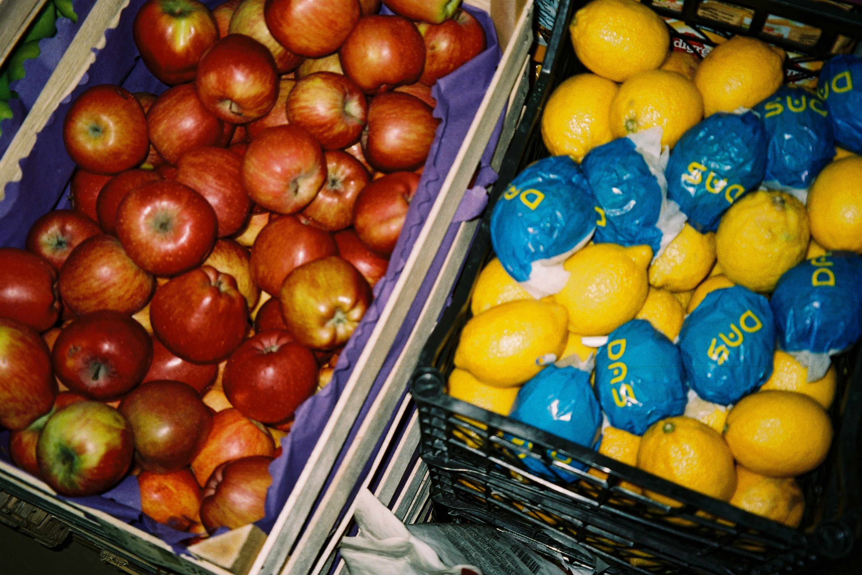 a couple of baskets full of fruits