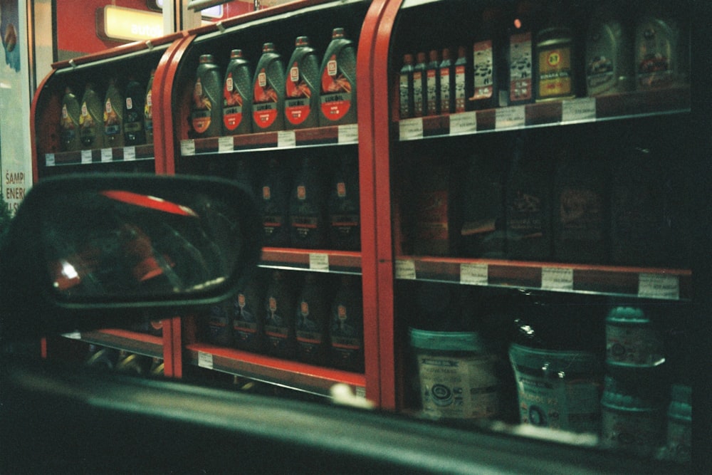 a shelf with bottles of alcohol on it