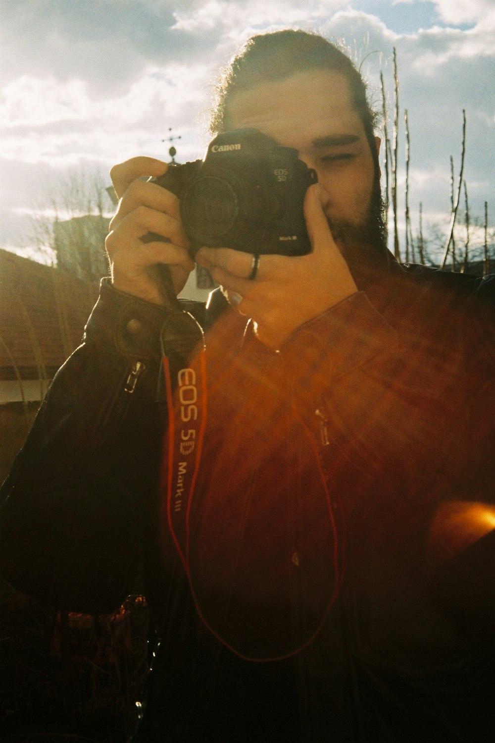 a man taking a picture with a camera