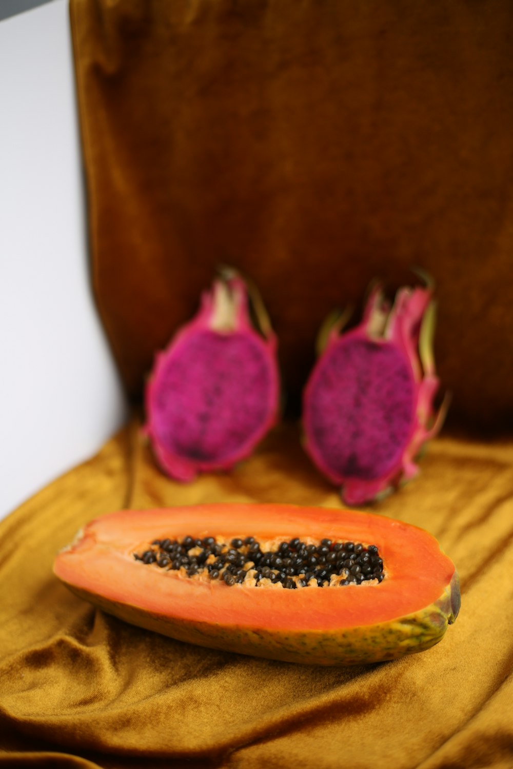 a person's hand holding a fruit