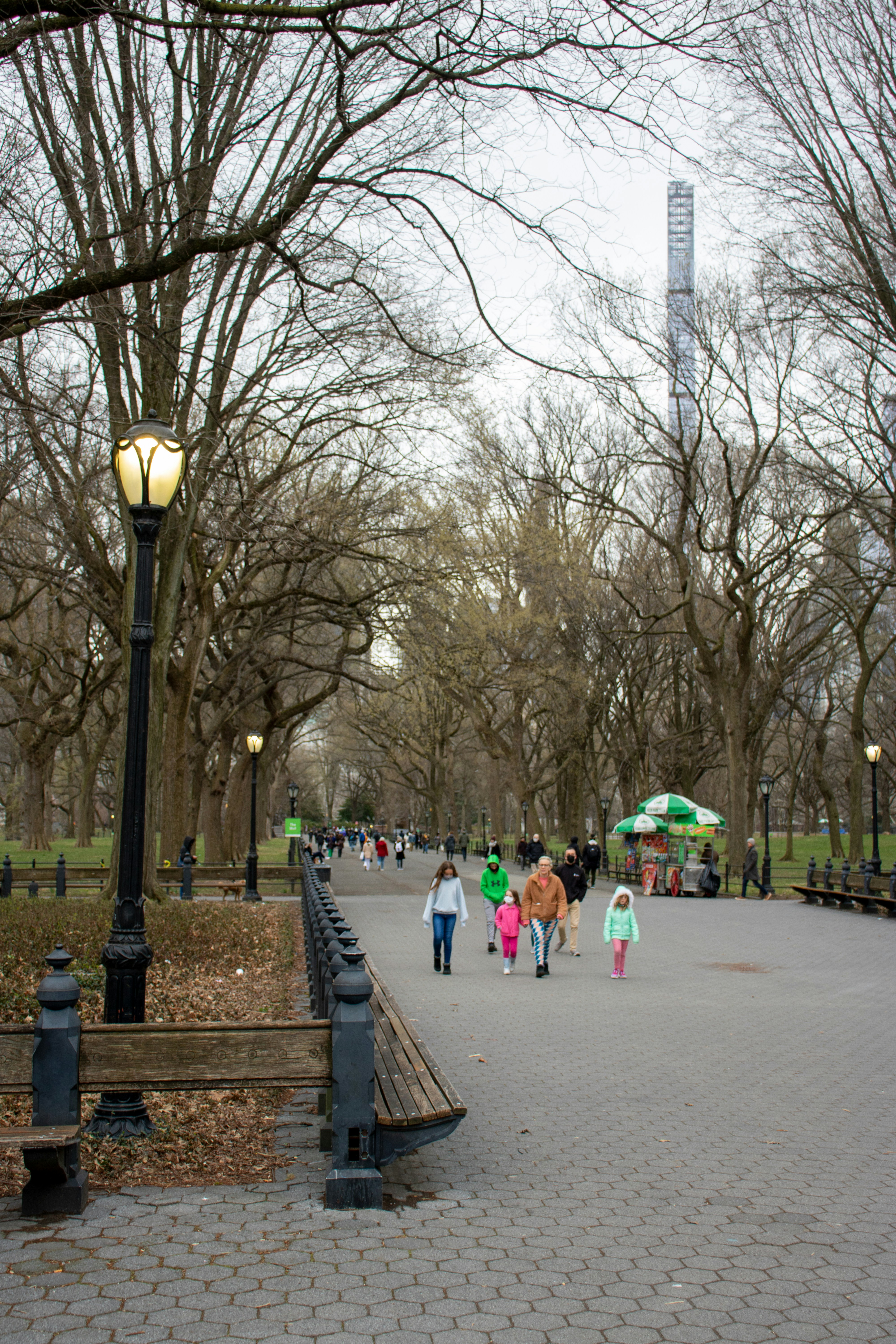 people walking on a sidewalk