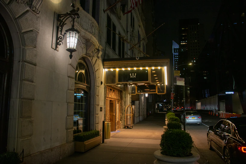 Front view of Hotel Las Vegas entrance with modern architecture and welcoming lighting at dusk