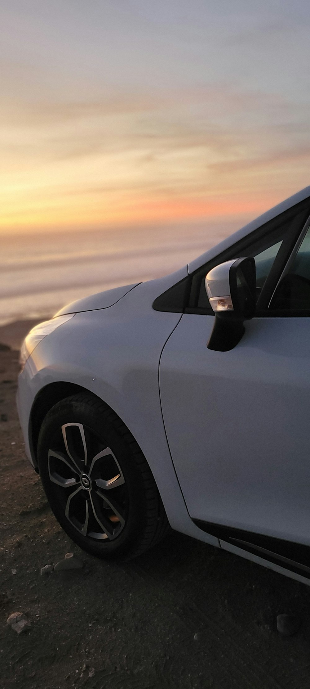 a car parked on a dirt road