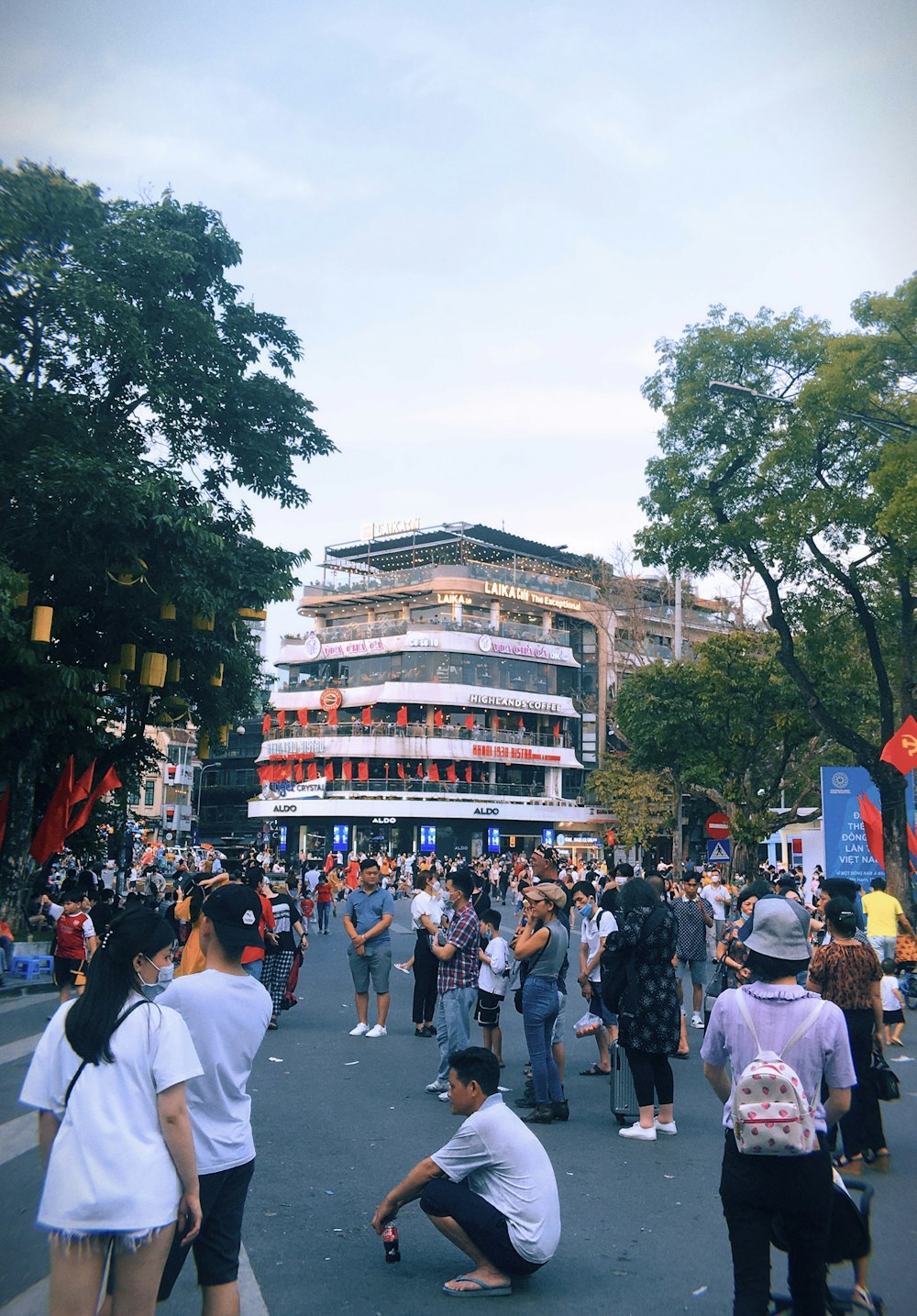 a crowd of people walking on a street