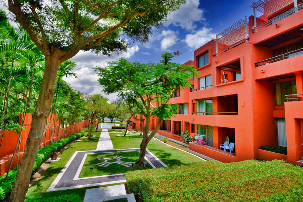 a building with trees and grass