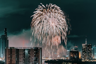 fireworks in the sky over a city