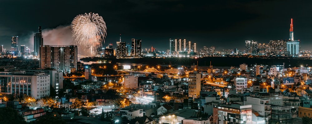 a city with fireworks in the sky