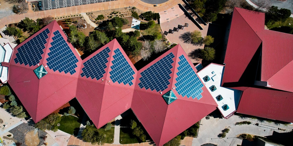 a group of buildings with red roofs