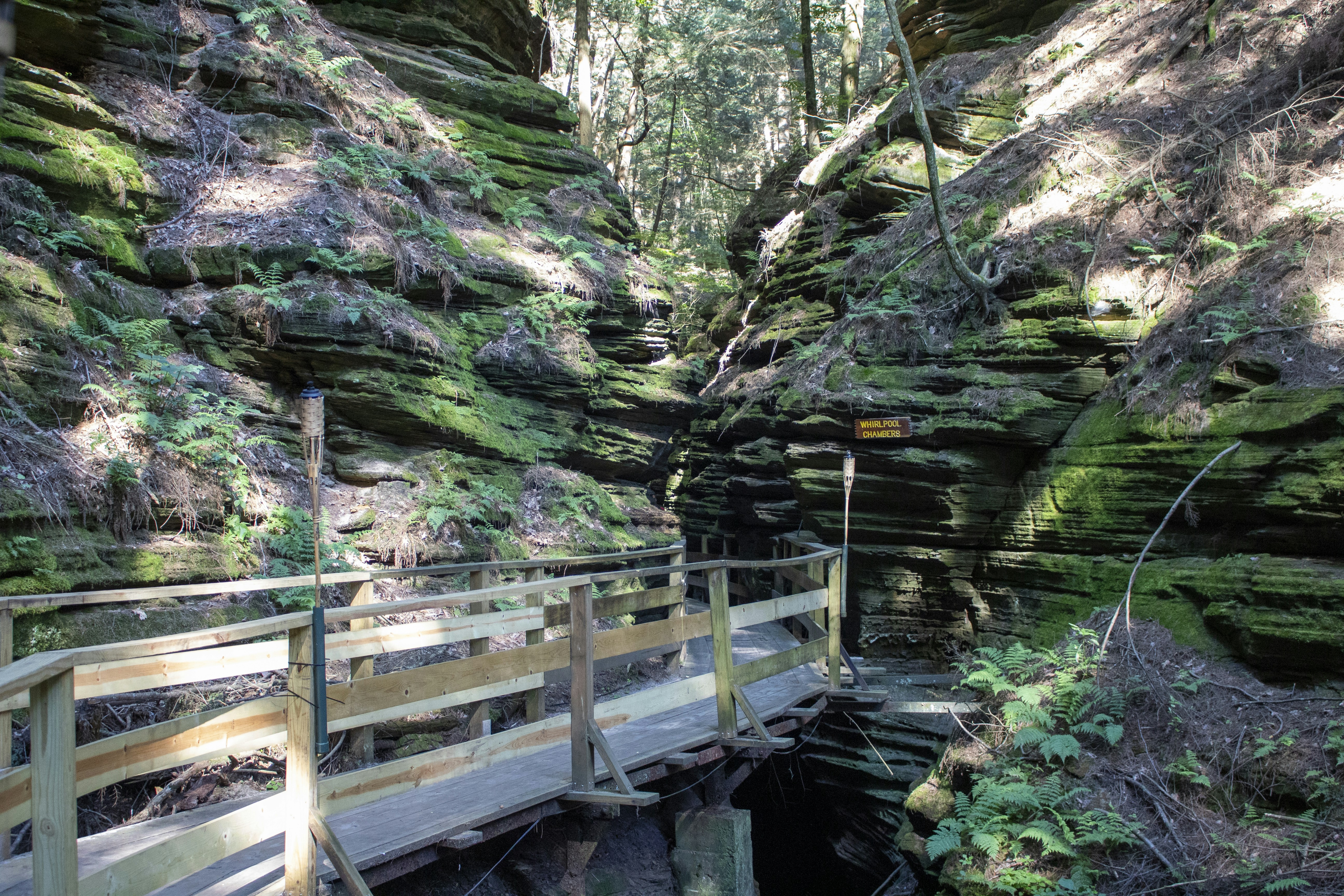 a wooden bridge over a river